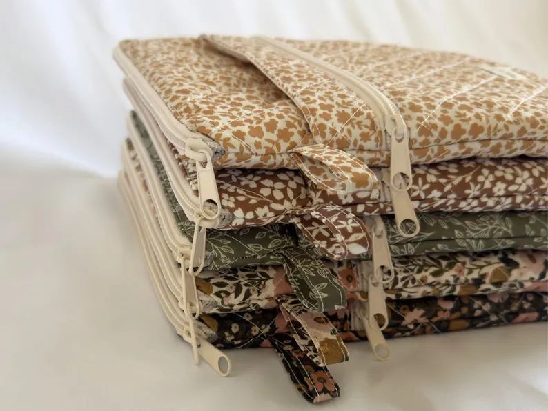 Protective fabric book sleeve designed to keep books safe while traveling.