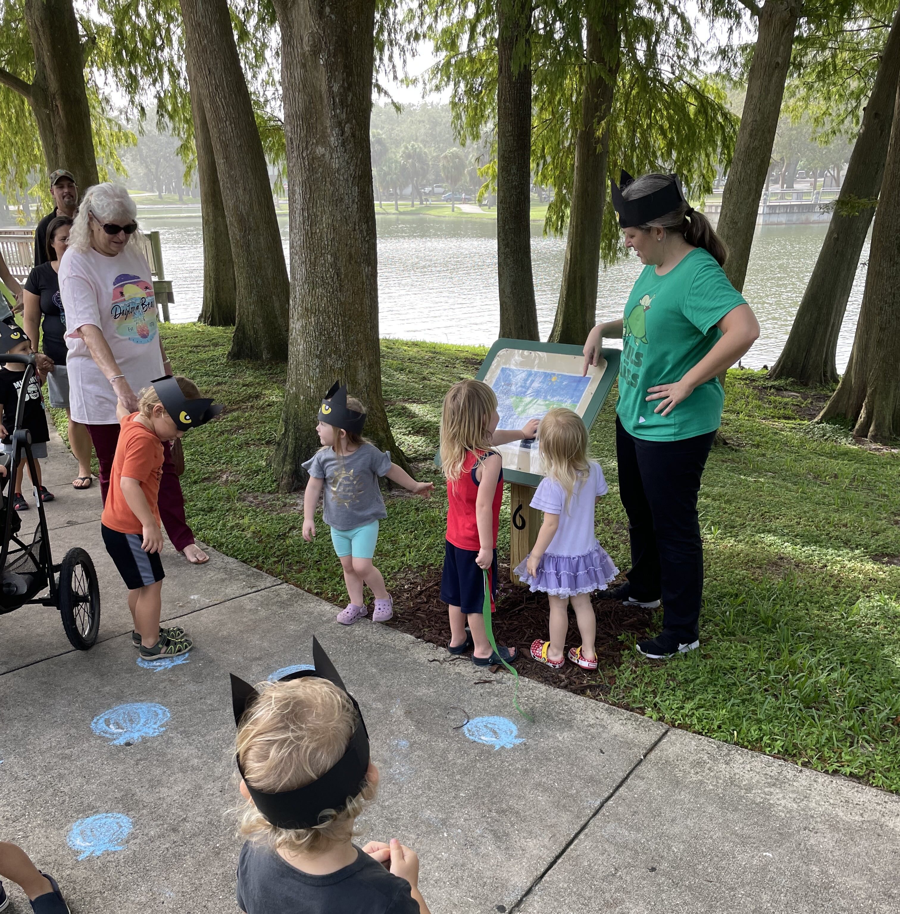Walking around the lake next to our library with kids after storytime. There is a story stroll where kids get to read a two page spread from a book. It is pulled from the book and on display on a podium. You walk around the whole walk, stopping to read a couple of pages at a time. Once you walk all the way around, you've read the whole book. It's a creative way to read with kids.