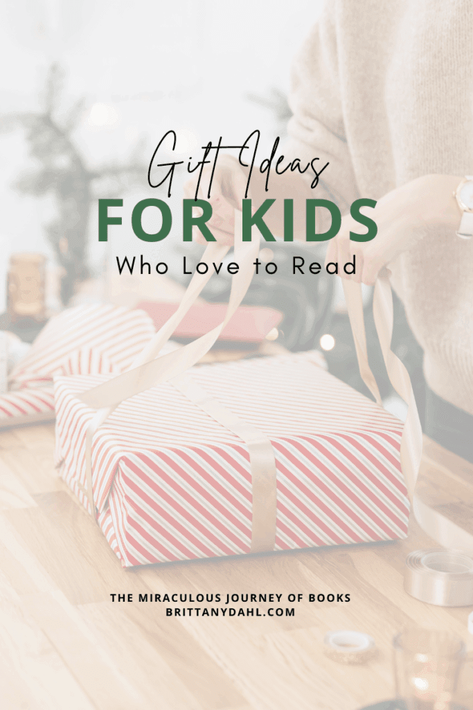 Gift Ideas for Kids Who Love to Read. A gift guide from The Miraculous Journey of Books at BrittanyDahl.com Image of woman wrapping a present with red and white striped wrapping paper.