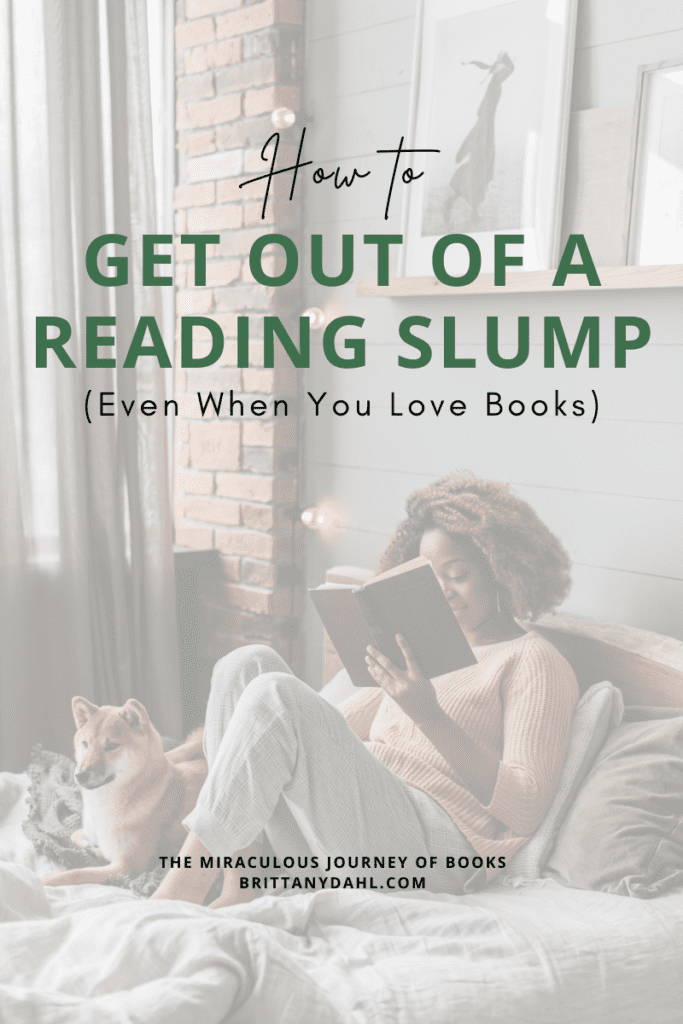 How to get out of a reading slump (even when you love books). Image of woman sitting in a bed reading a book. Her dog is lying beside her as she reads. A blog post by The Miraculous Journey of Books at BrittanyDahl.com.