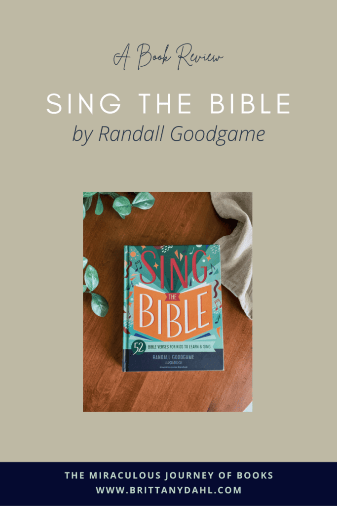 A Book Review: Sing the Bible by Randall Goodgame. Image of the cover of the book on a dark colored table.